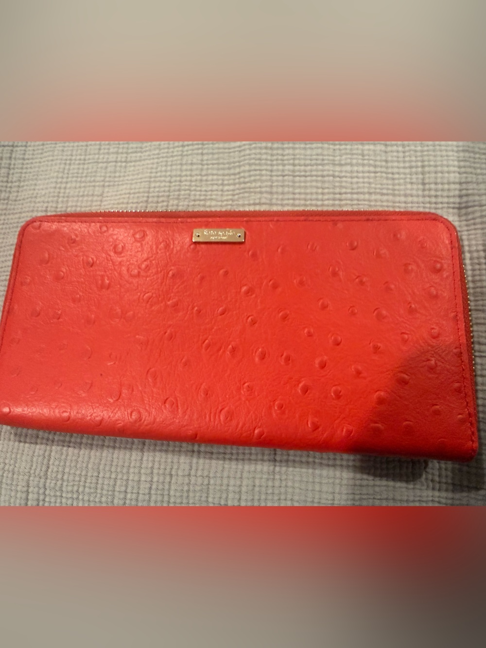 kate spade red ostrich-embossed zip-around wallet